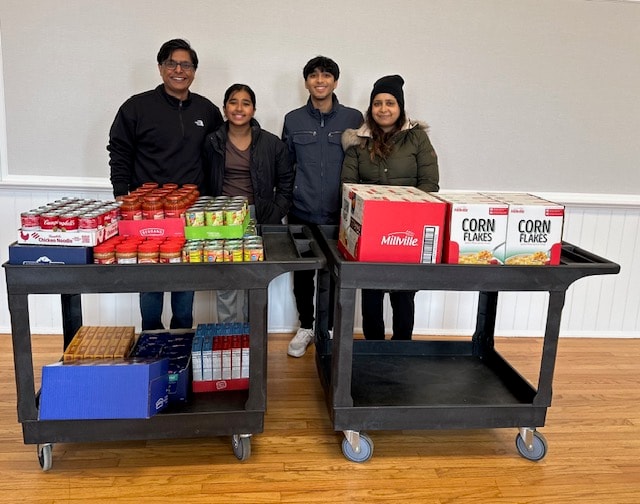 Diverse volunteers serving the local community at an outdoor food distribution